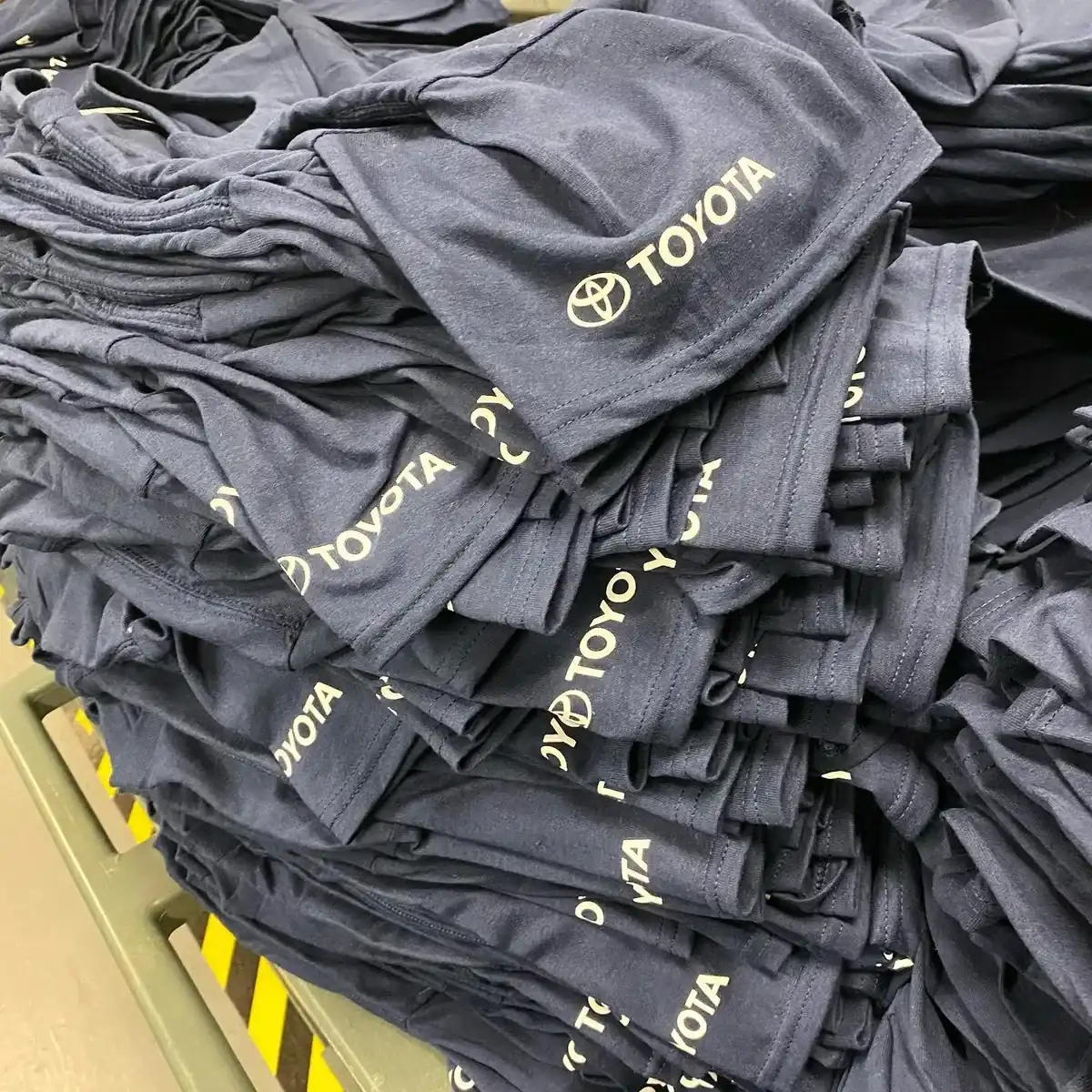 Bulk workwear t-shirt order with company logos — workwear printing Woking