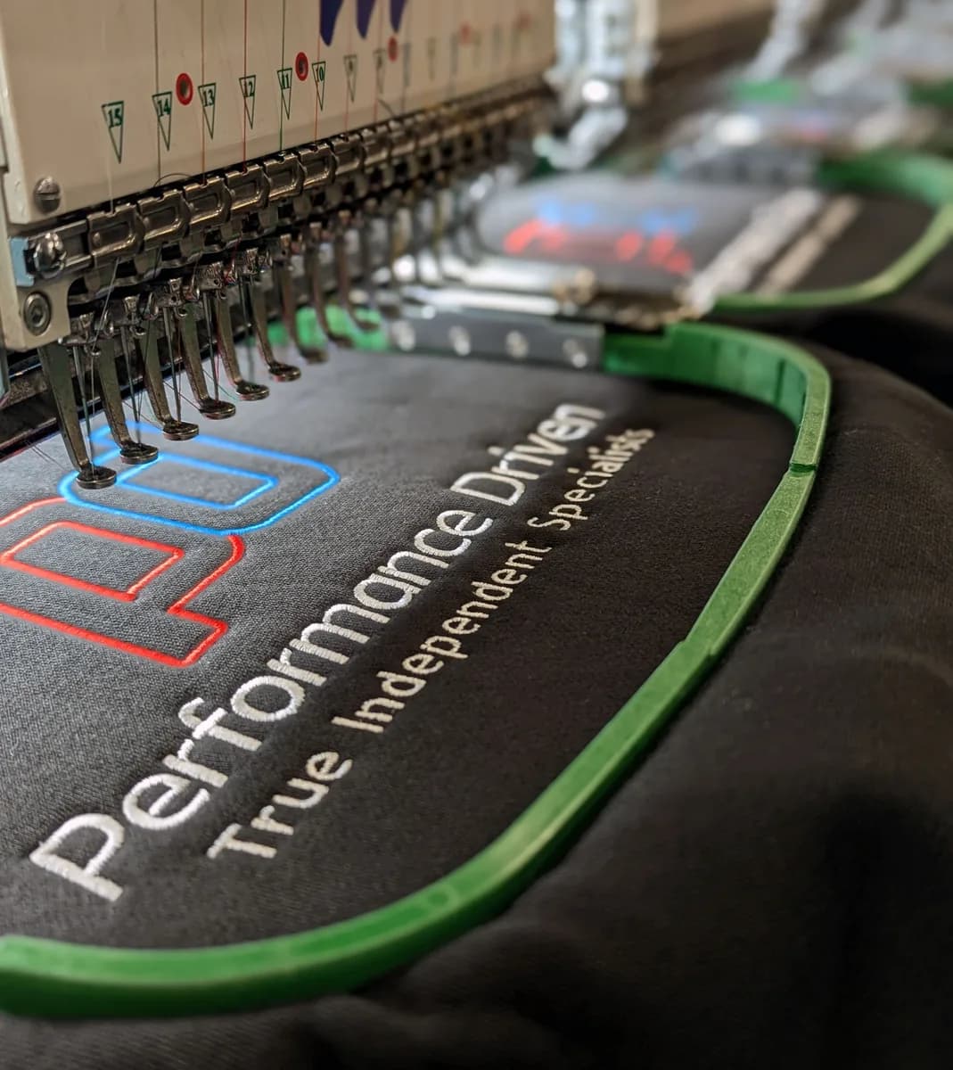 Custom embroidered workwear sample with company logo — embroidery services Woking